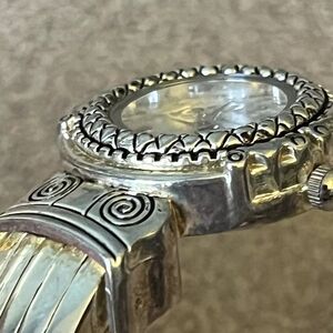 Silver and Gold Tone Watch with Intricate Design